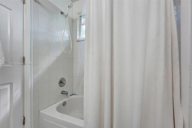 bathroom featuring shower / bath combo with shower curtain