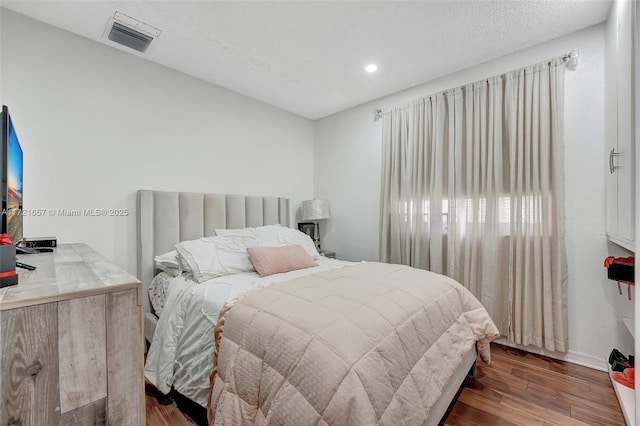 bedroom featuring hardwood / wood-style flooring