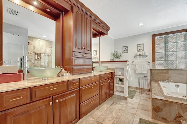 bathroom featuring vanity and a relaxing tiled tub