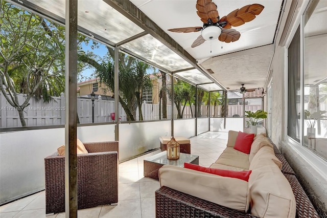 sunroom with ceiling fan and a wealth of natural light