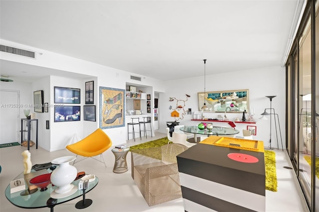 kitchen featuring white cabinets and stainless steel fridge