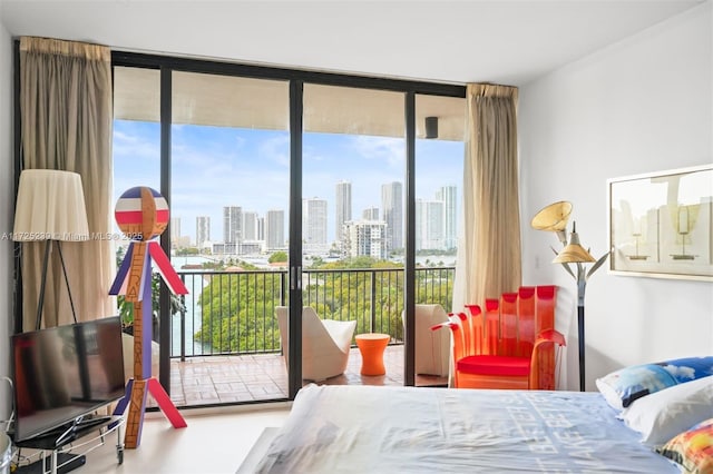 bedroom featuring access to exterior and floor to ceiling windows