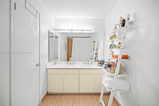 bathroom featuring vanity and wood-type flooring