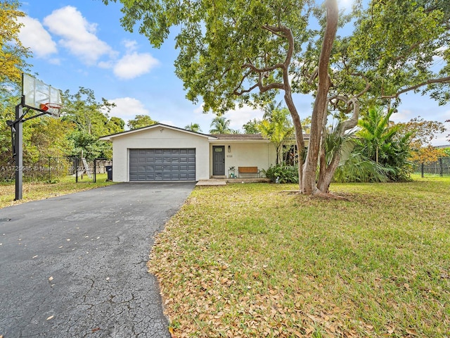 single story home with a front lawn and a garage