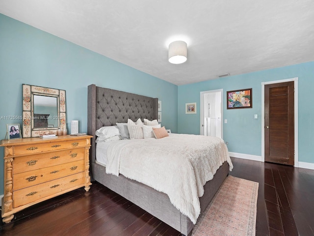 bedroom featuring dark hardwood / wood-style floors