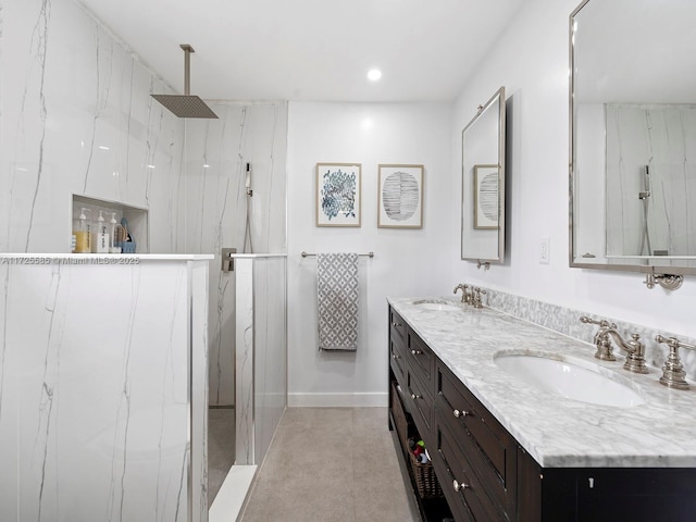 bathroom with vanity and a shower