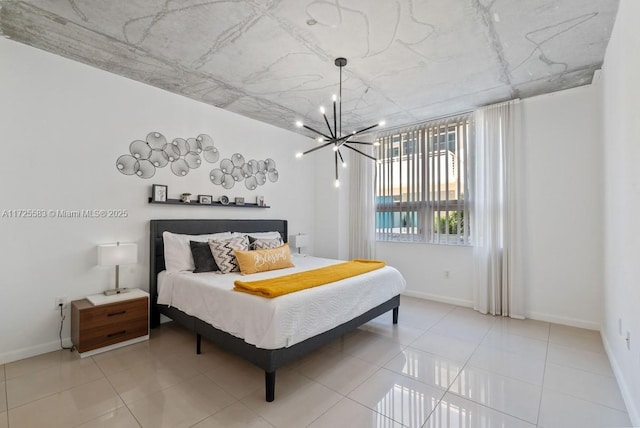 bedroom with an inviting chandelier and light tile patterned flooring