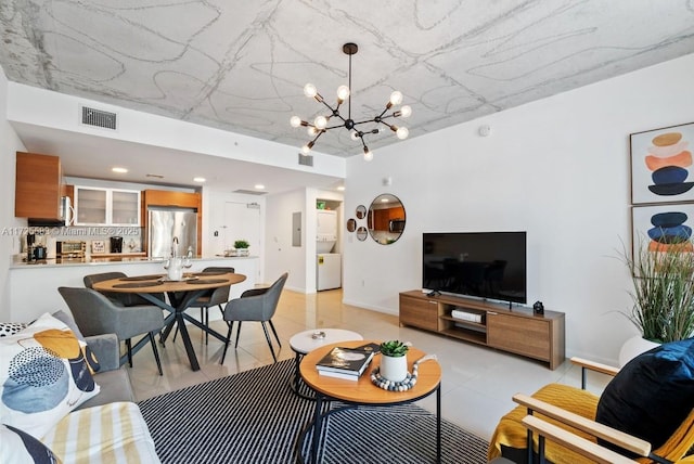 living room featuring a notable chandelier