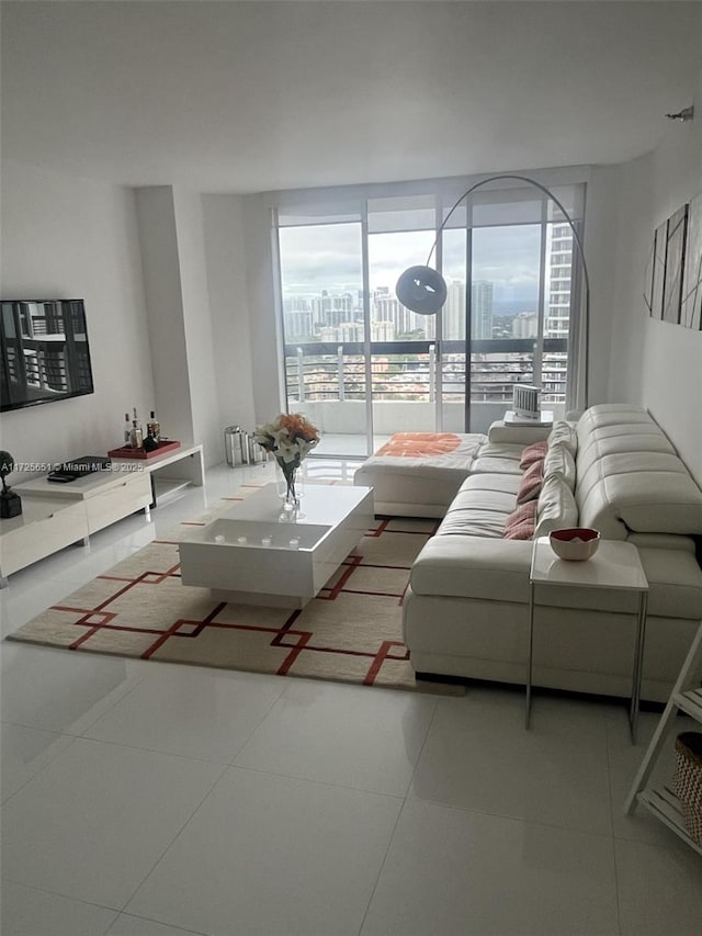 living room with a healthy amount of sunlight and tile patterned flooring