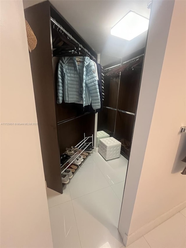 walk in closet featuring tile patterned floors