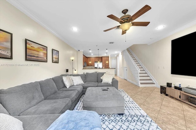 tiled living room featuring ornamental molding and ceiling fan