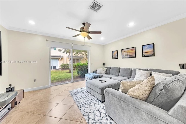 living room featuring ornamental molding, ceiling fan, and light tile patterned flooring