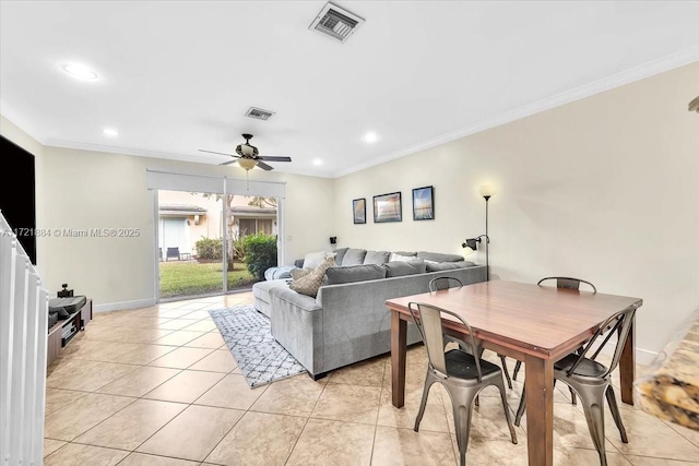 living room featuring crown molding, ceiling fan, and light tile patterned floors