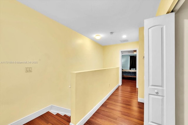 hallway with wood-type flooring