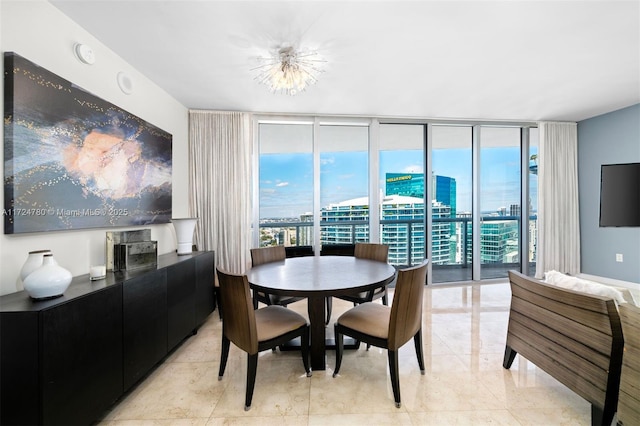 dining room featuring floor to ceiling windows, an inviting chandelier, and plenty of natural light