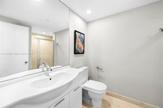 bathroom featuring toilet, an enclosed shower, vanity, and tile patterned floors