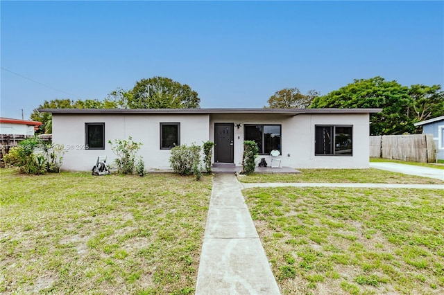 ranch-style house with a front yard