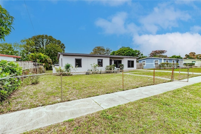 single story home with a front yard