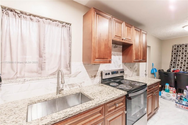 kitchen featuring sink, backsplash, electric stove, and light stone countertops