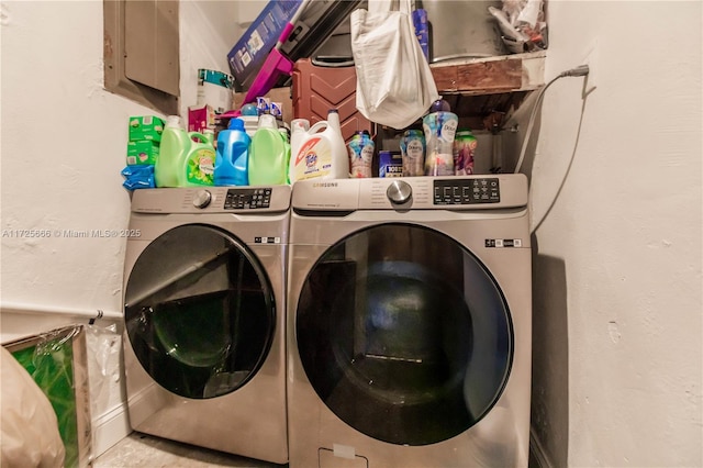 clothes washing area featuring separate washer and dryer