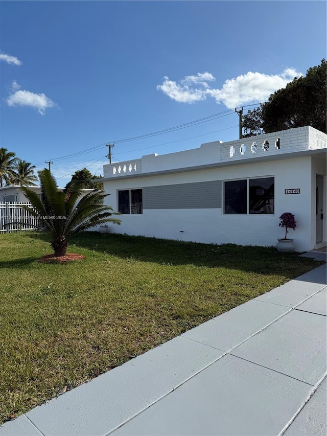 view of property exterior with a lawn