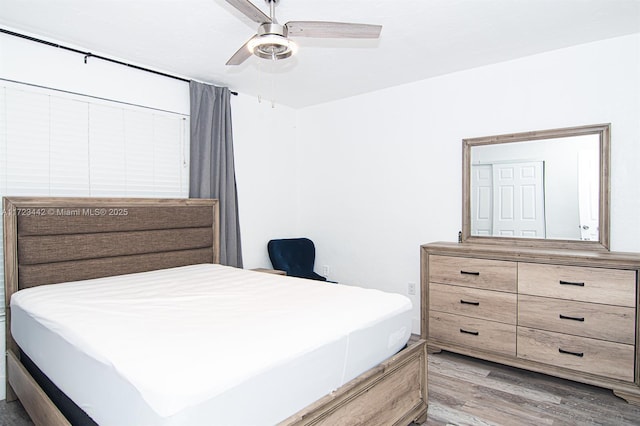 bedroom featuring ceiling fan and wood-type flooring