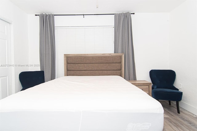 bedroom featuring hardwood / wood-style flooring