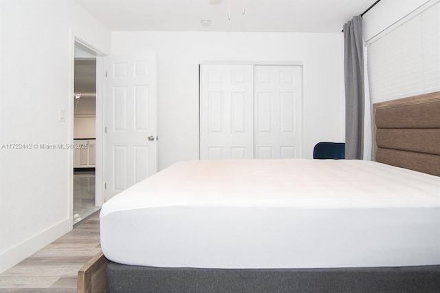 bedroom featuring a closet and hardwood / wood-style floors