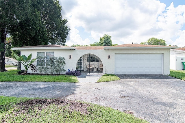 ranch-style home with a garage