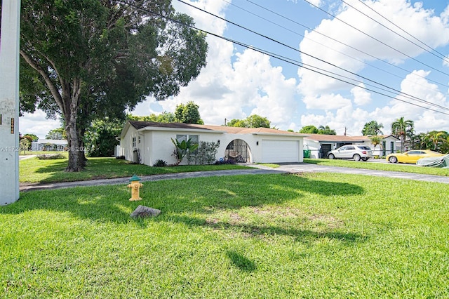 ranch-style house with a front yard and a garage