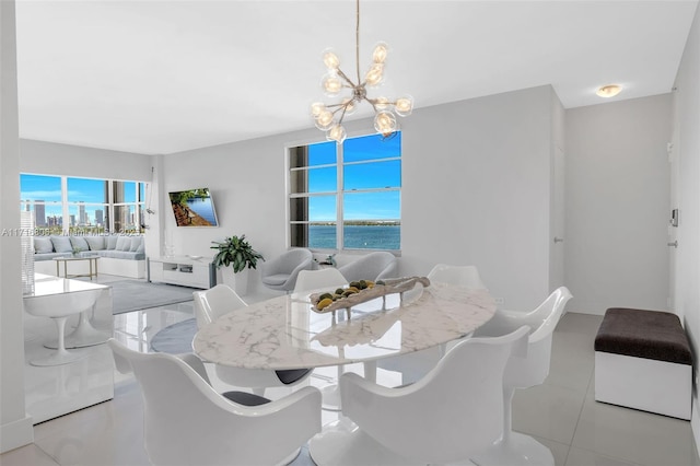 dining area with an inviting chandelier