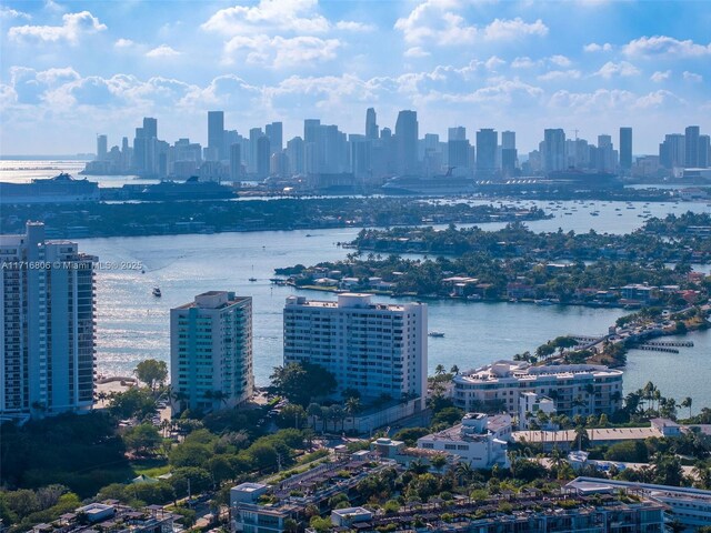 exterior space featuring a view of city and a water view