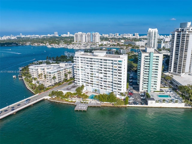 bird's eye view featuring a water view and a city view