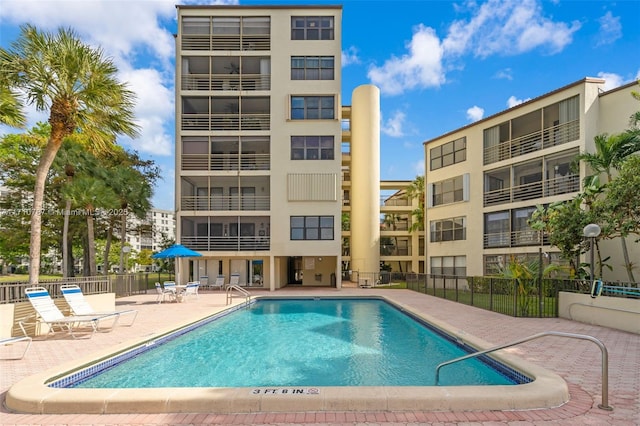 view of swimming pool with a patio