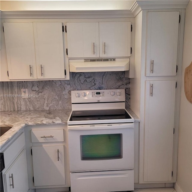 kitchen featuring white electric range, white cabinets, backsplash, and light stone countertops