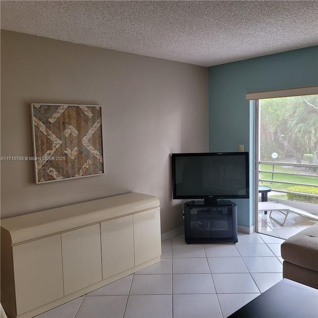 unfurnished living room featuring a textured ceiling and light tile patterned floors