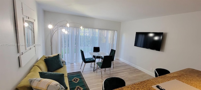 dining space featuring light hardwood / wood-style floors