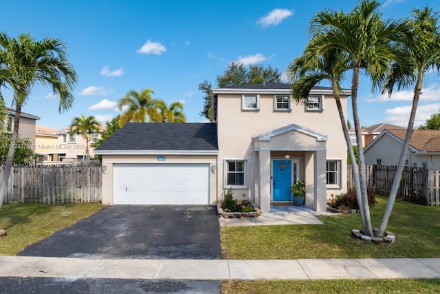 view of front facade with a front lawn and a garage