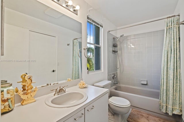 full bathroom featuring toilet, shower / bathtub combination with curtain, and vanity