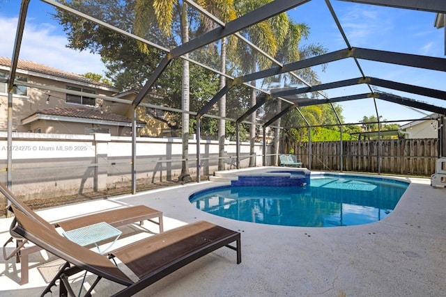 view of pool featuring a lanai and a patio area