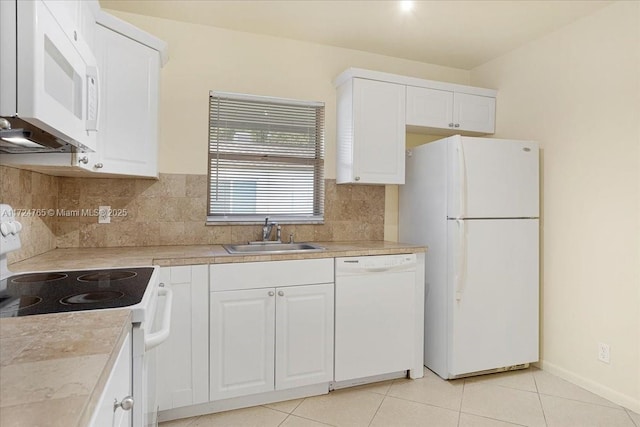 kitchen featuring sink, white cabinetry, white appliances, light tile patterned floors, and backsplash