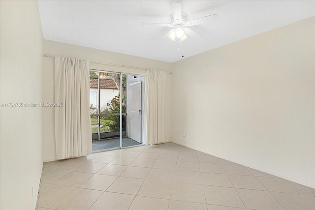 unfurnished room featuring ceiling fan and light tile patterned flooring