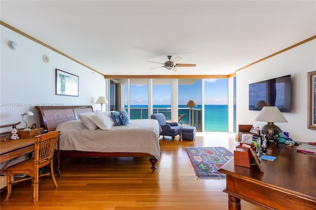 bedroom featuring floor to ceiling windows, hardwood / wood-style flooring, crown molding, ceiling fan, and access to exterior