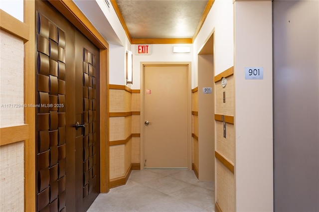 hallway featuring ornamental molding