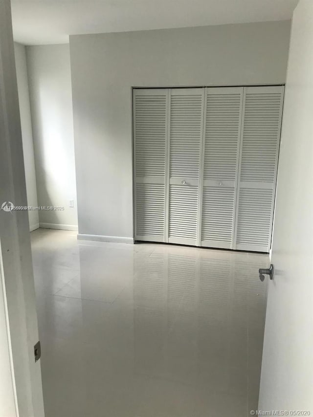 unfurnished bedroom with a closet