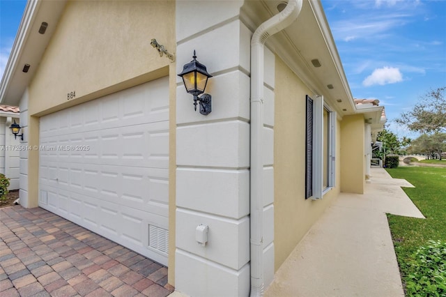 view of side of property with a garage