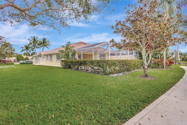 view of yard with a lanai