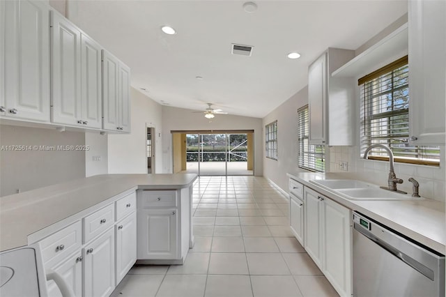 kitchen with white cabinetry, dishwasher, kitchen peninsula, and sink