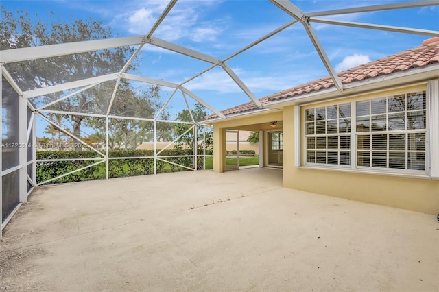 view of patio with glass enclosure