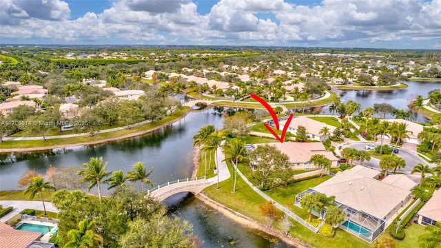 birds eye view of property with a water view